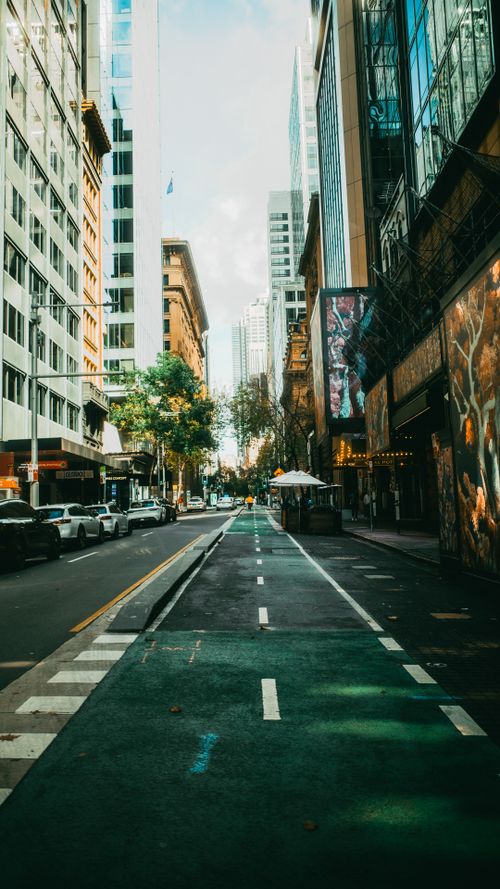 Free Dynamic street scene at central Sydney with tall buildings and vibrant urban life. Stock Photo