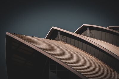 Close-up view of a modern architectural roof showing unique, curved de — Photo by Neil Smith on Pexels