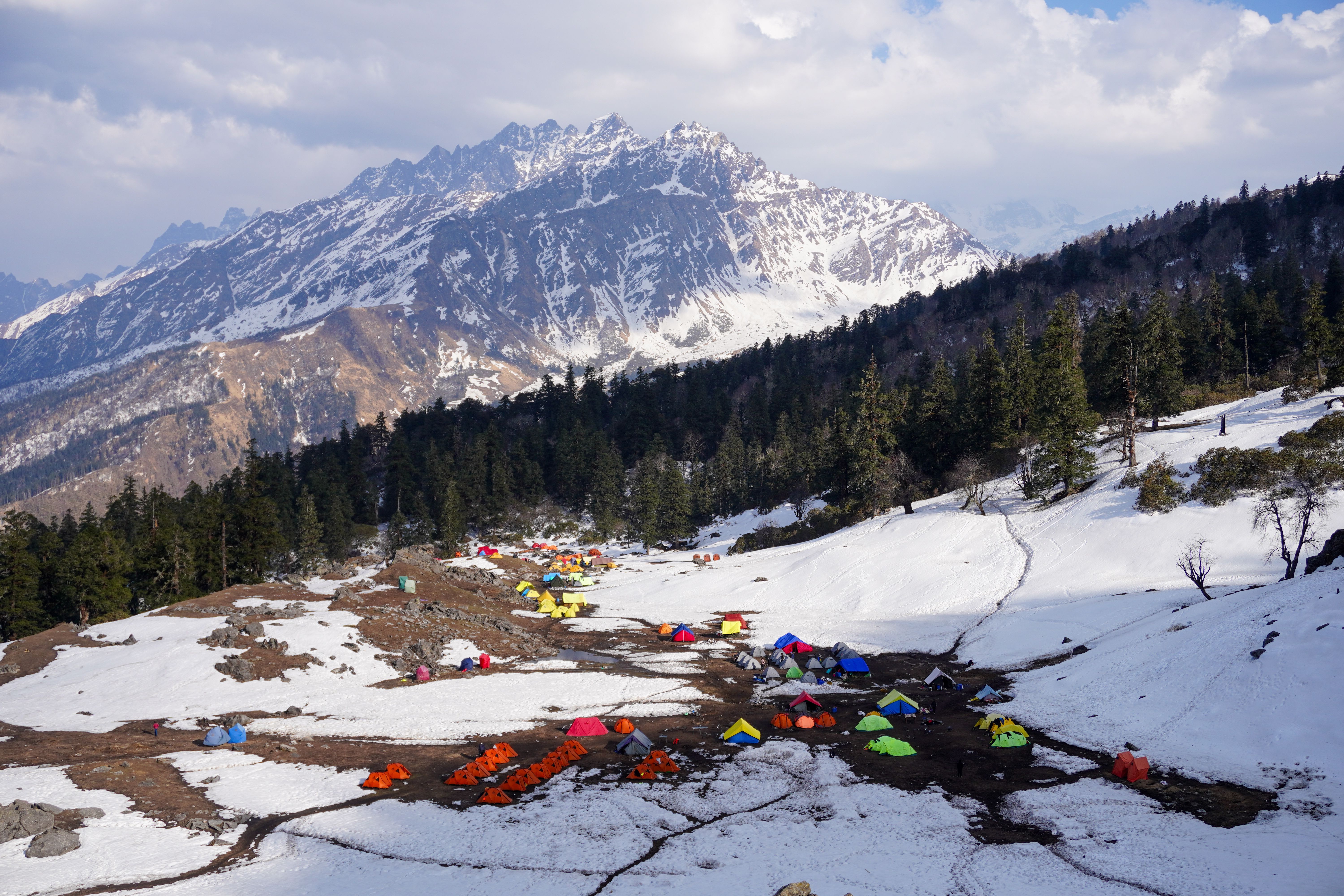Explore the snowy mountains and colorful tents in Salud Dugra, Uttarakhand.