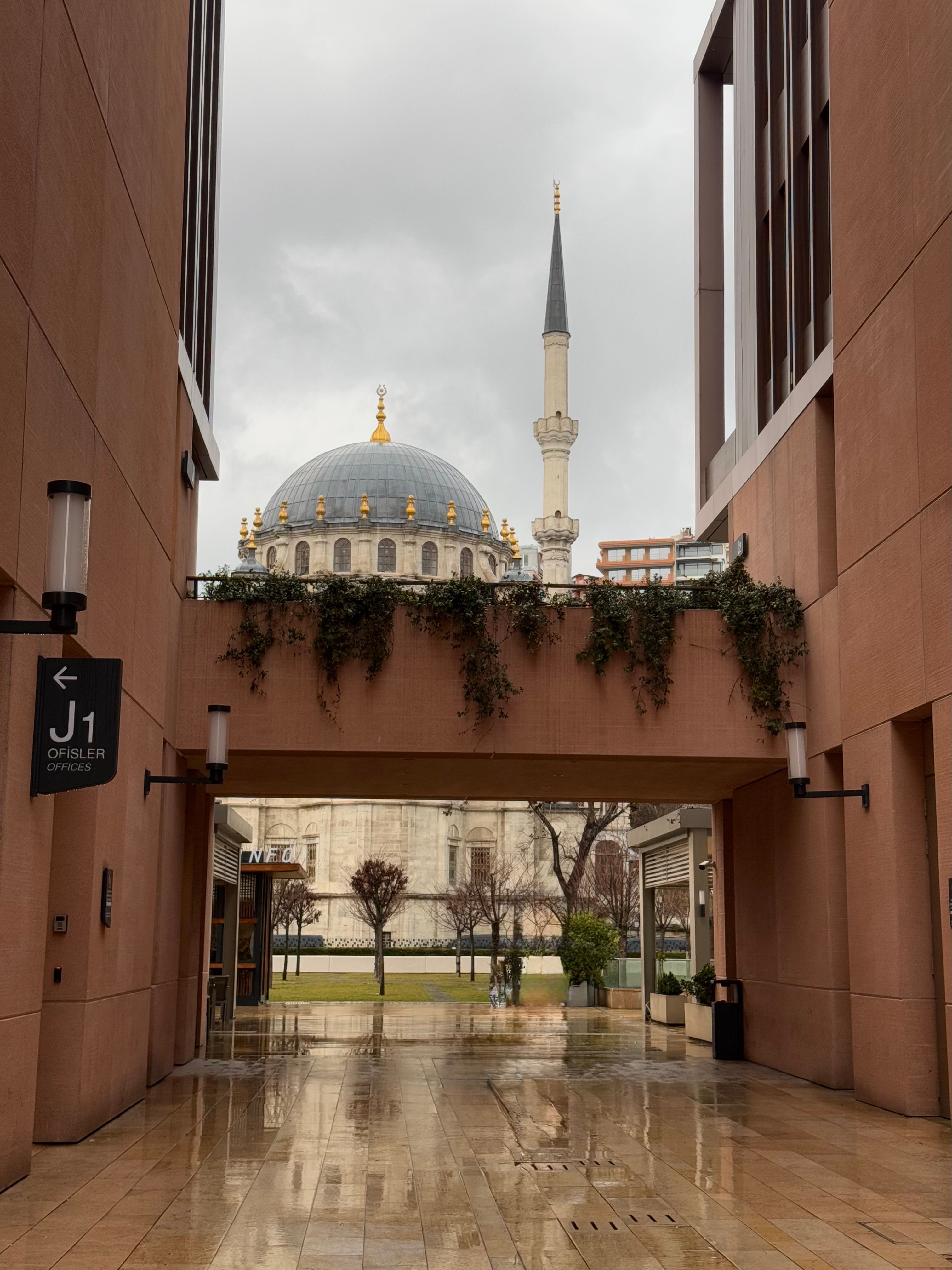 View of Mosque through Urban Passageway · Free Stock Photo