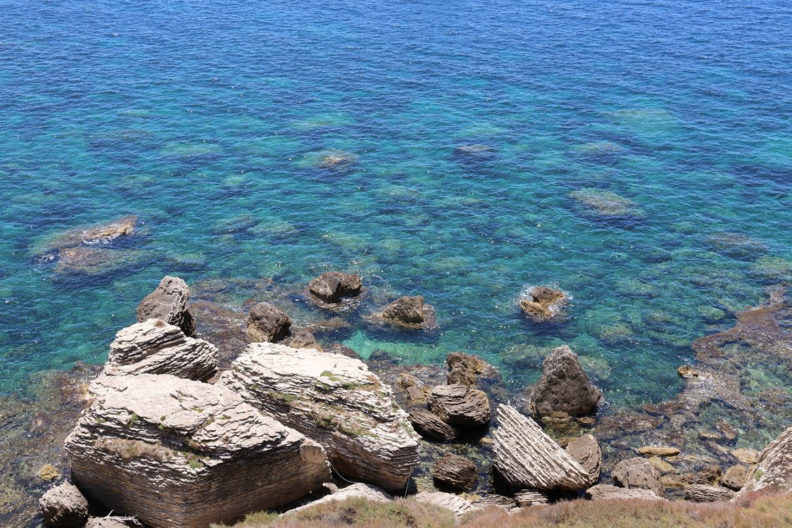 Clear Sea Rocks Scenic Coastal Rocks and Clear Blue Sea · Free Stock Photo