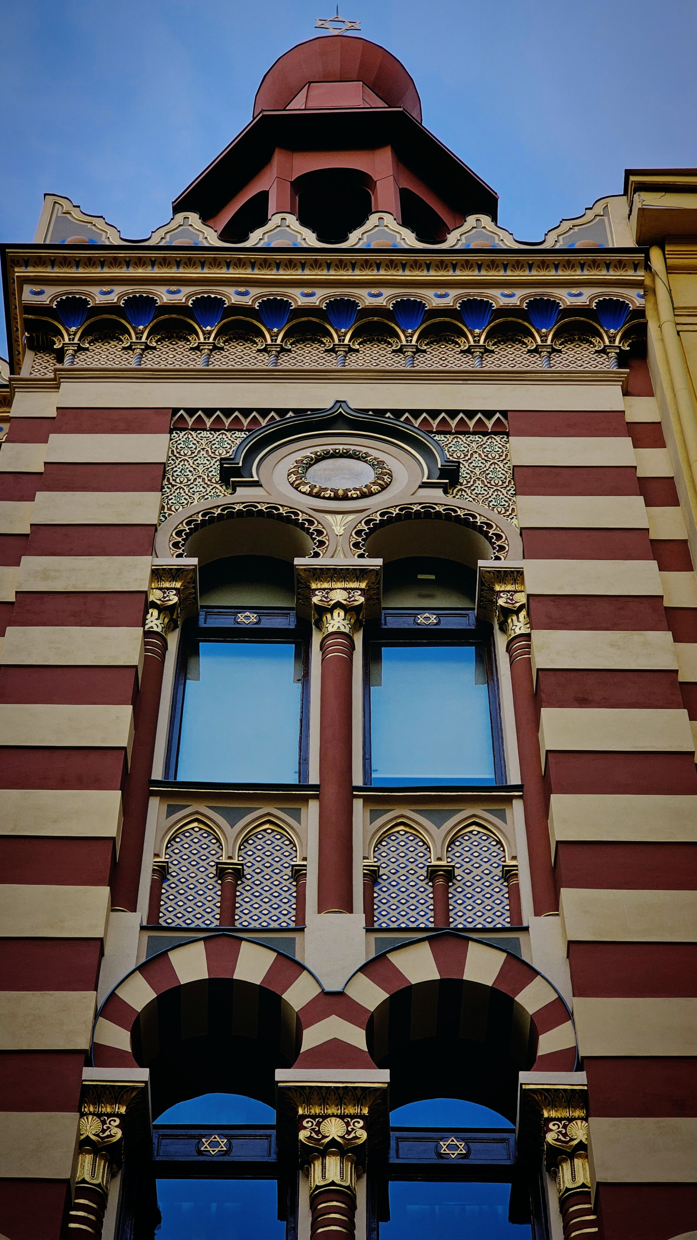 Ornate Historic Building Facade with Arches · Free Stock Photo