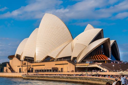 Free Majestic Sydney Opera House captured against a clear blue sky, showcasing its iconic architecture. Stock Photo