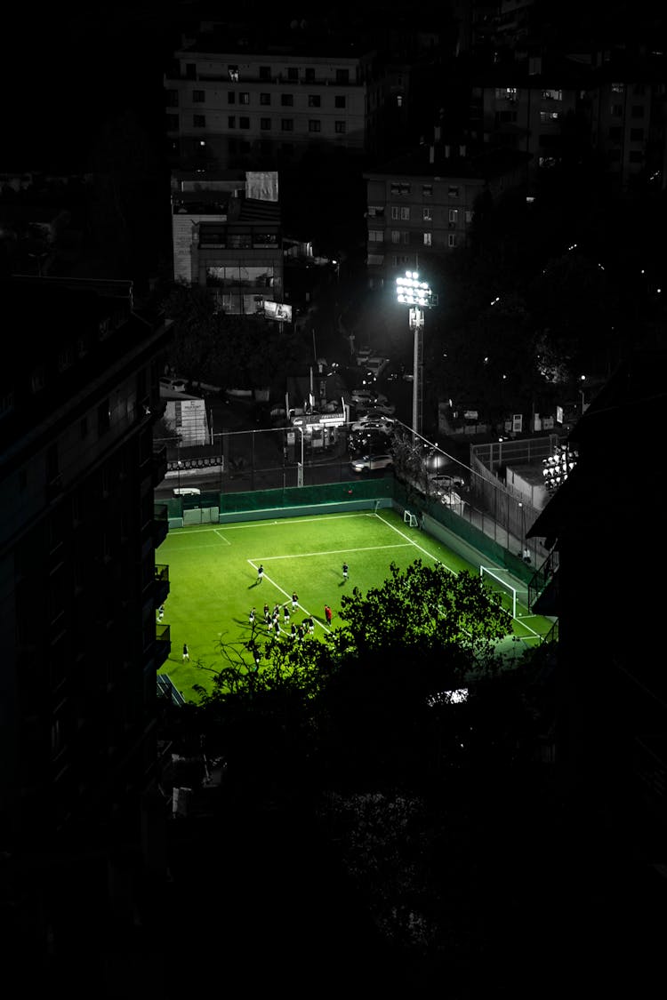 Soccer Players On Stadium At Night