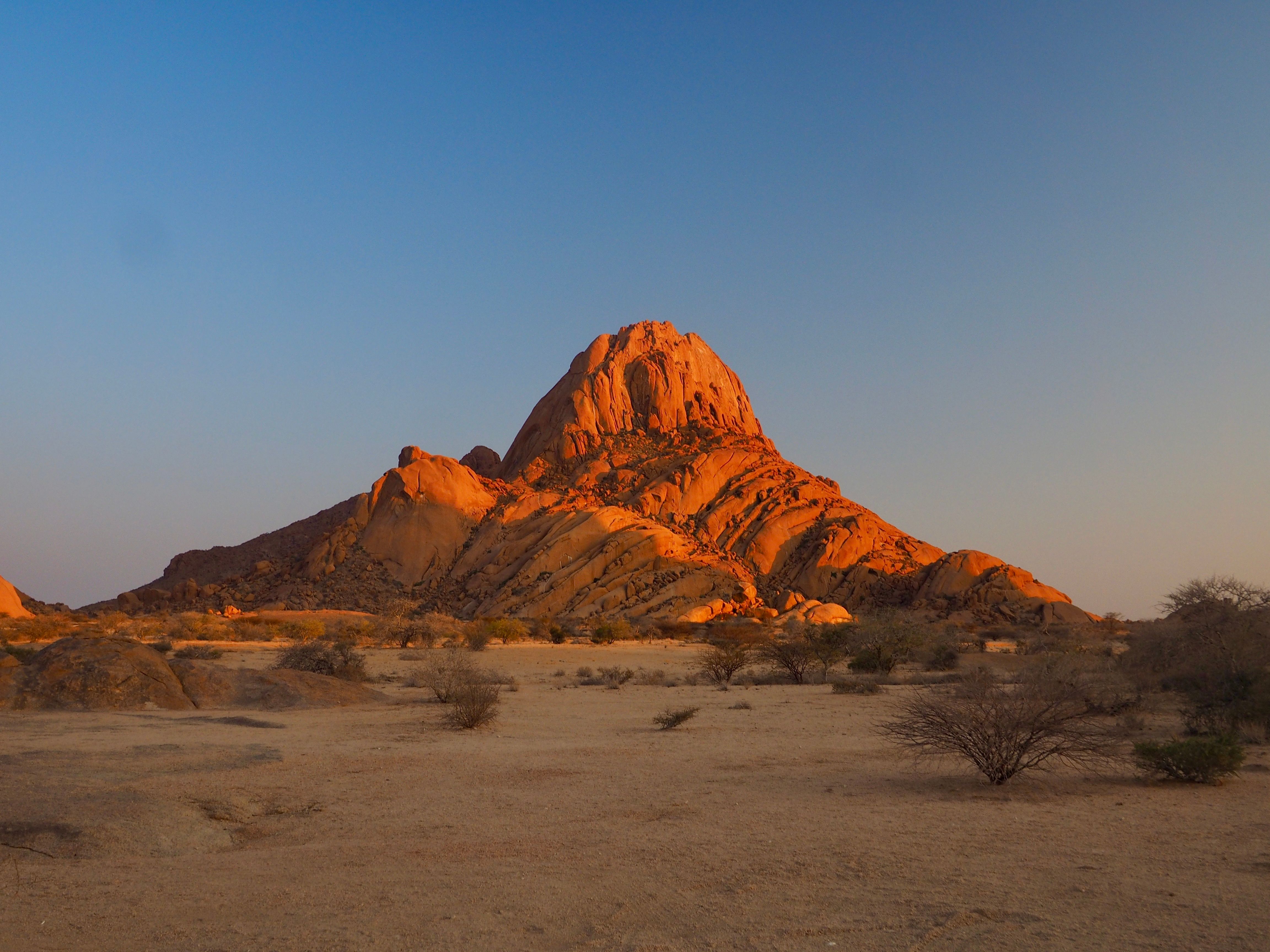 Stunning view of Spitzkoppe rock formation in Namibia during golden hour.
