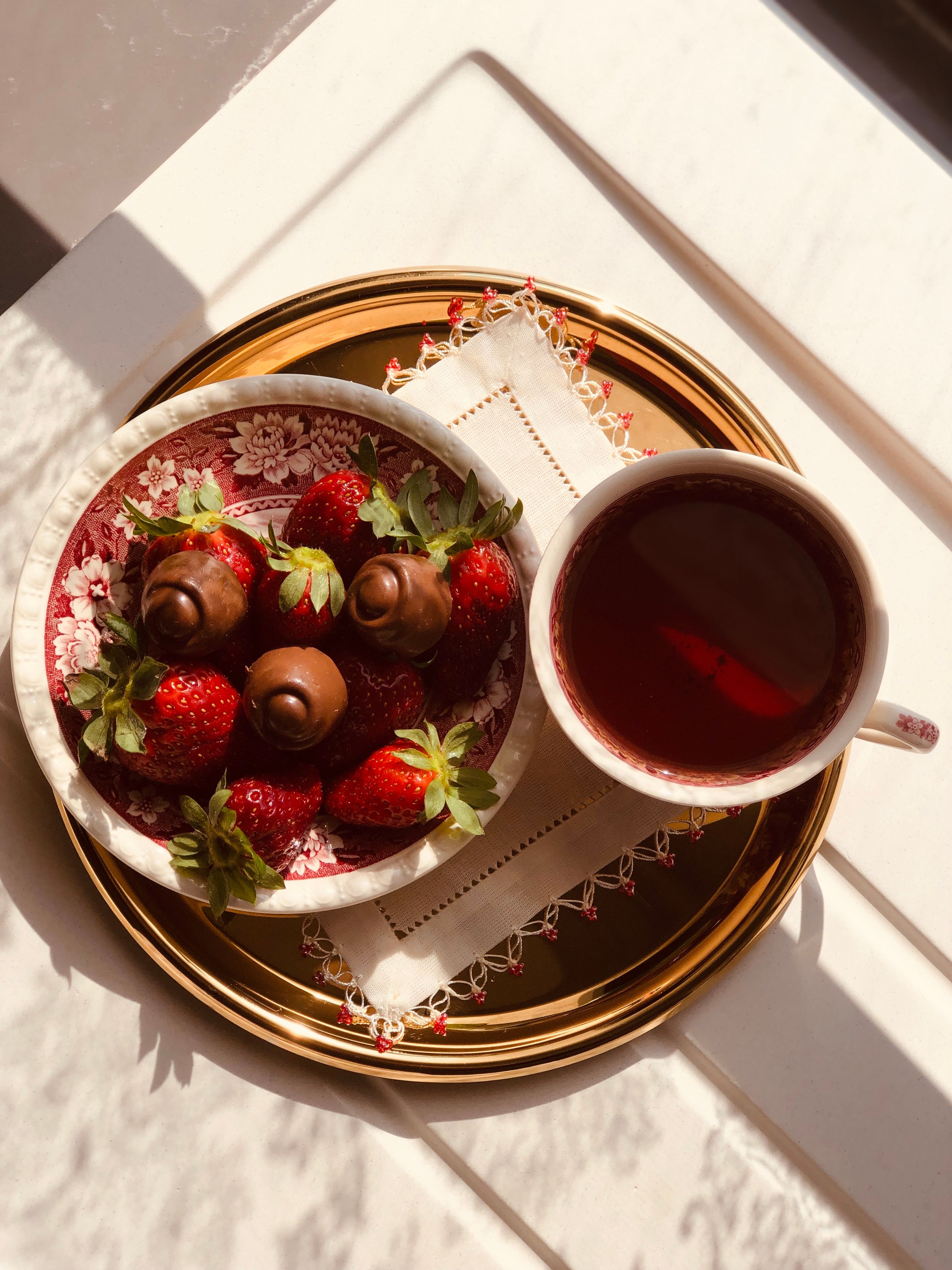 Elegant Tea Setting with Strawberries and Chocolates · Free Stock Photo