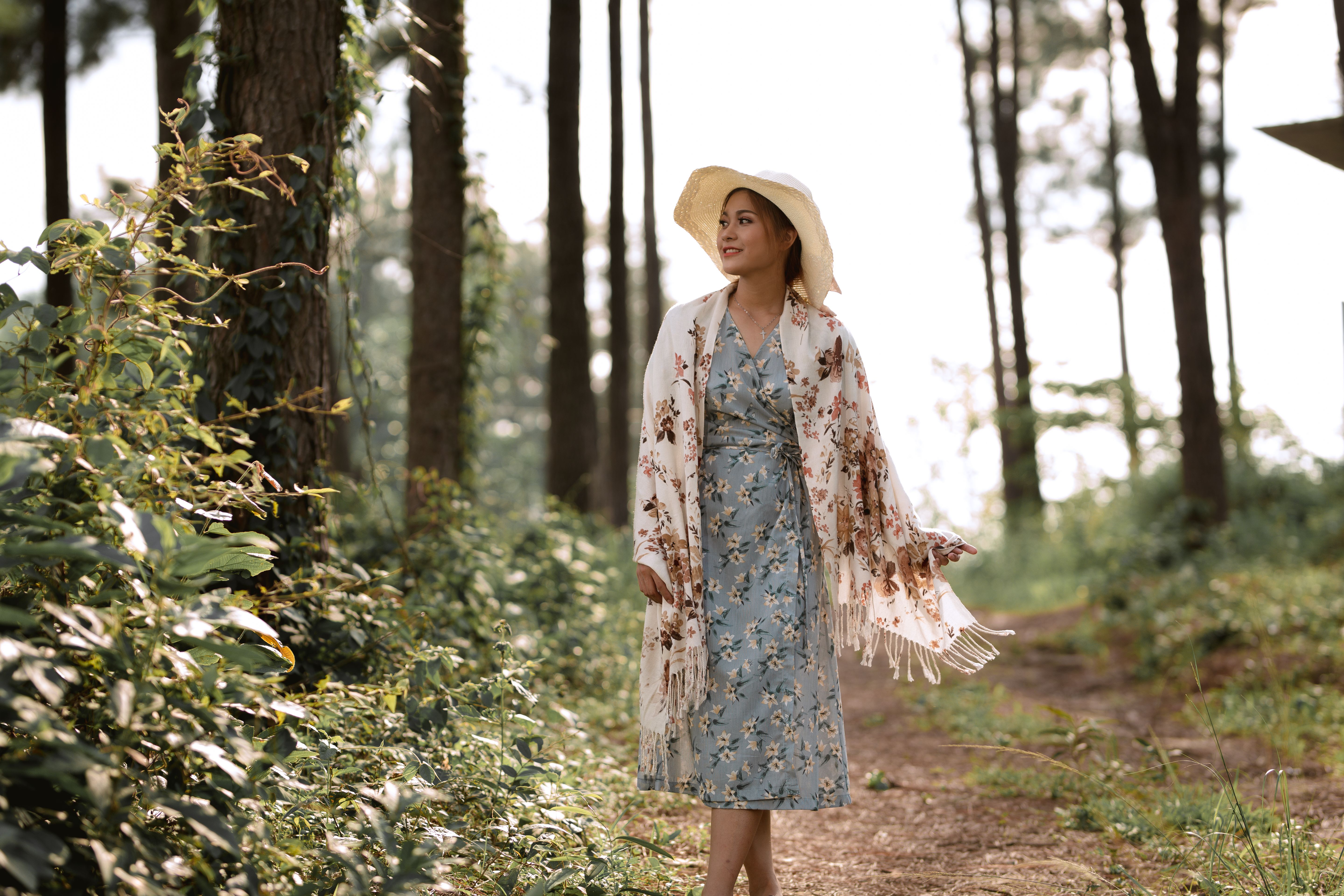 Woman Walking in Sunlit Forest in Vietnam · Free Stock Photo