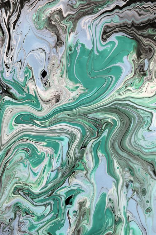 Free Vivid fluid art design with green, white, and black swirls creating a marble effect. Stock Photo