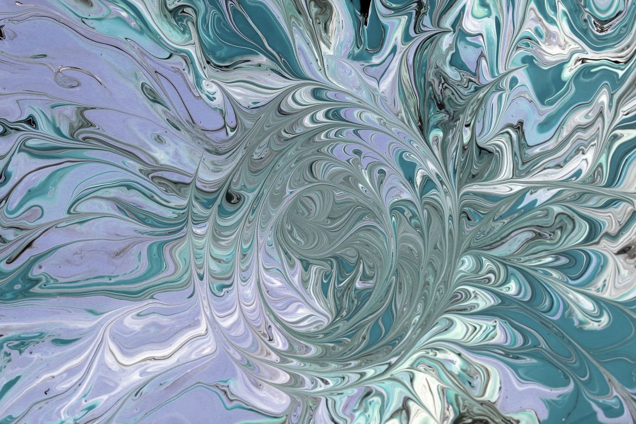 a mesmerizing abstract image featuring swirling teal and purple patter