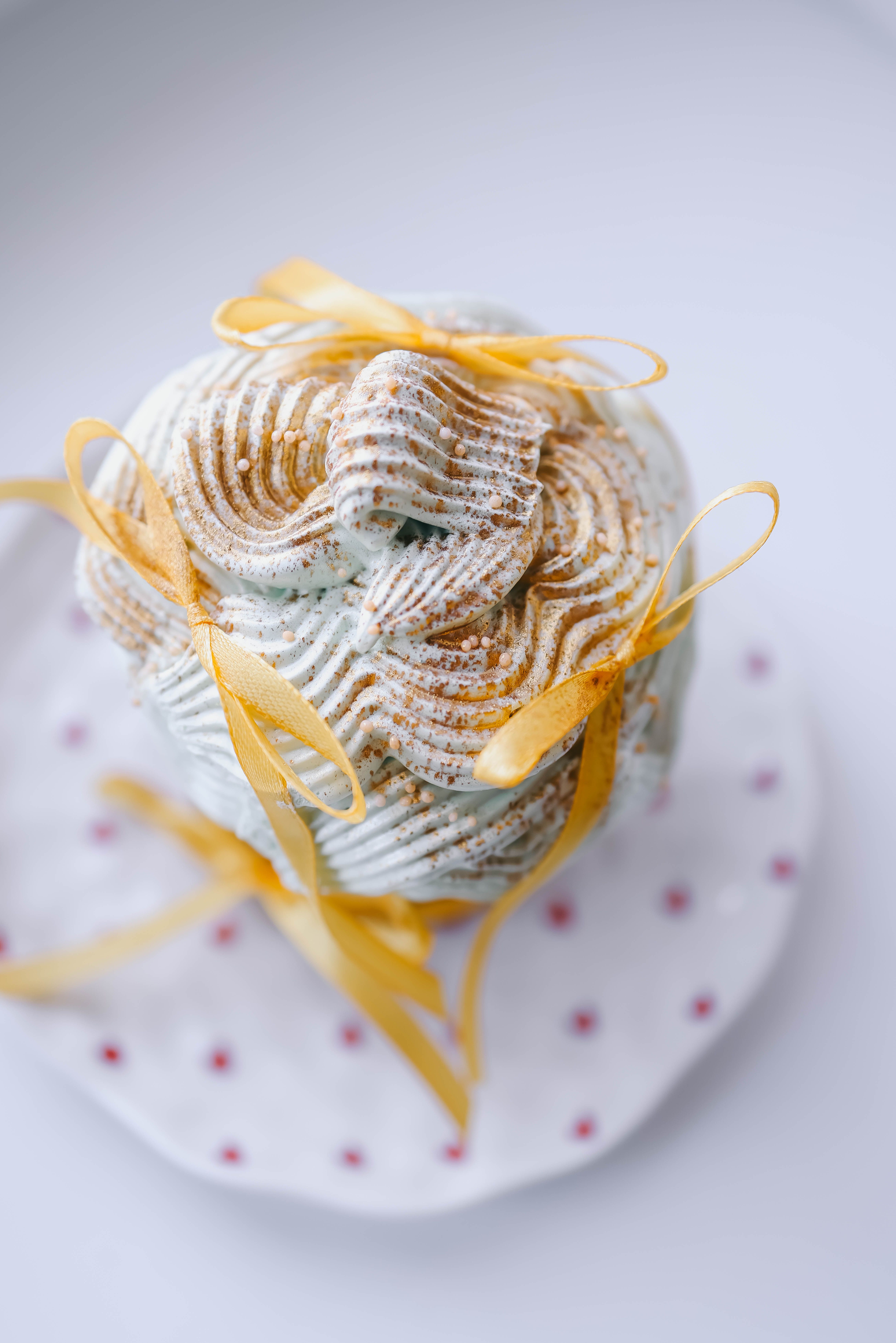 Elegant Cake Decoration with Yellow Ribbons · Free Stock Photo