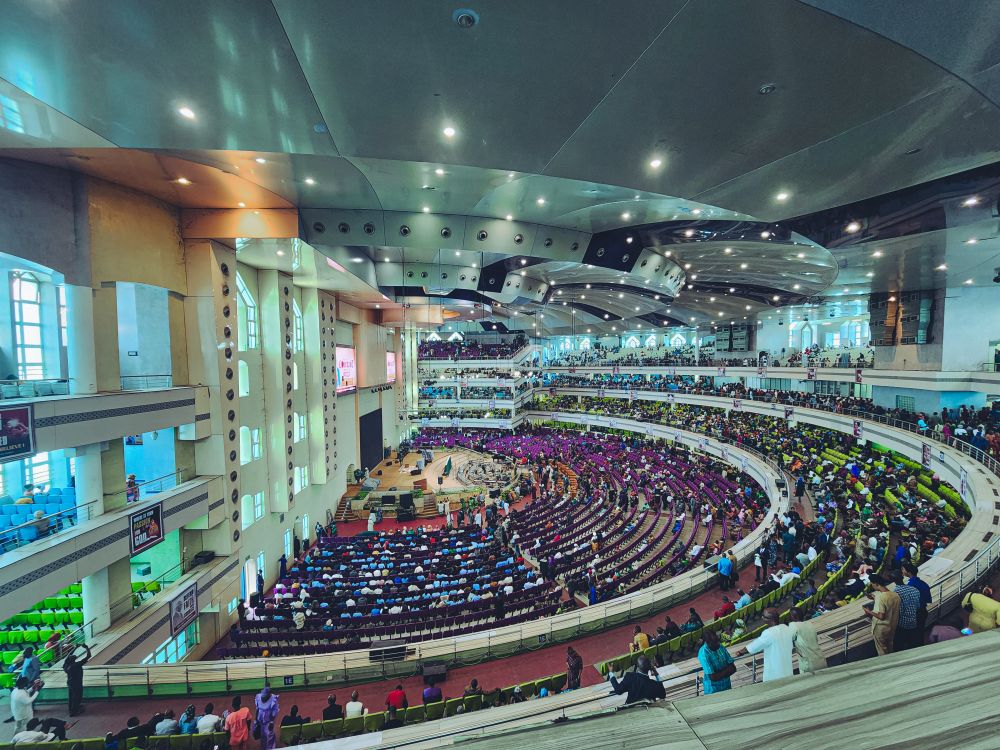 Large audience gathered in an indoor event hall