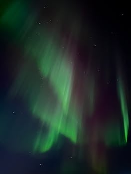 Stunning display of northern lights against a starry night sky in Canada.