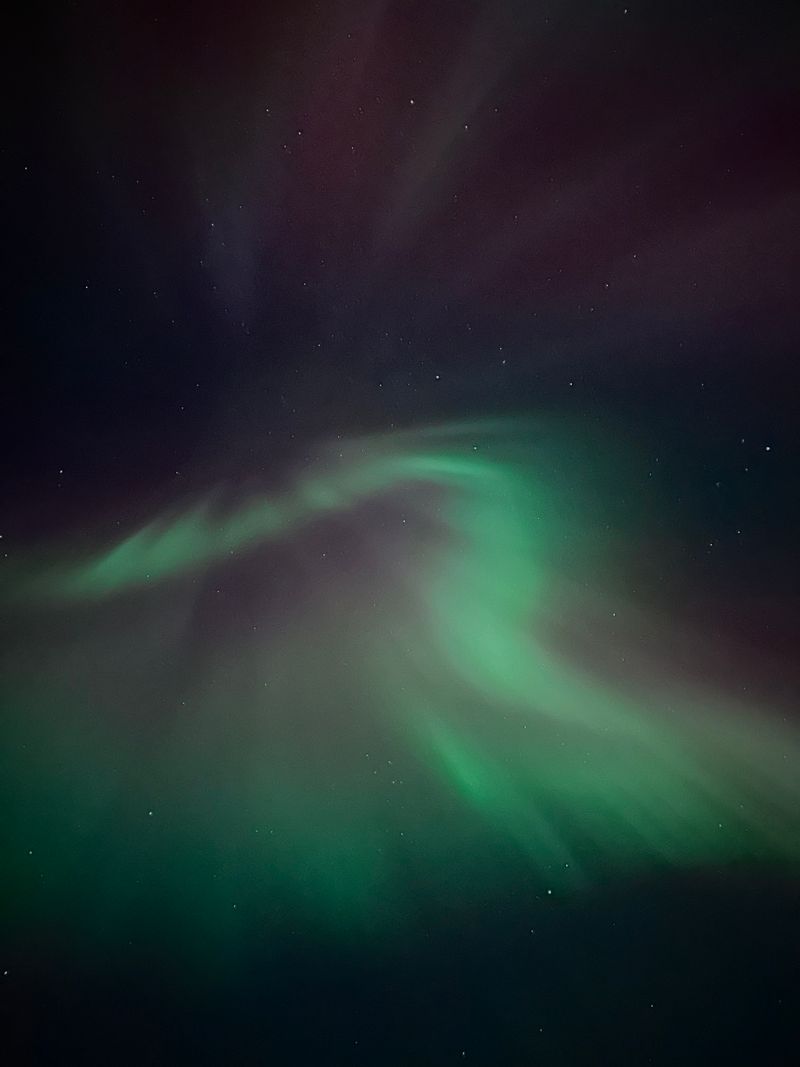 Northern lights over a starry night sky, photo by Hunter Schroeder on Pexels