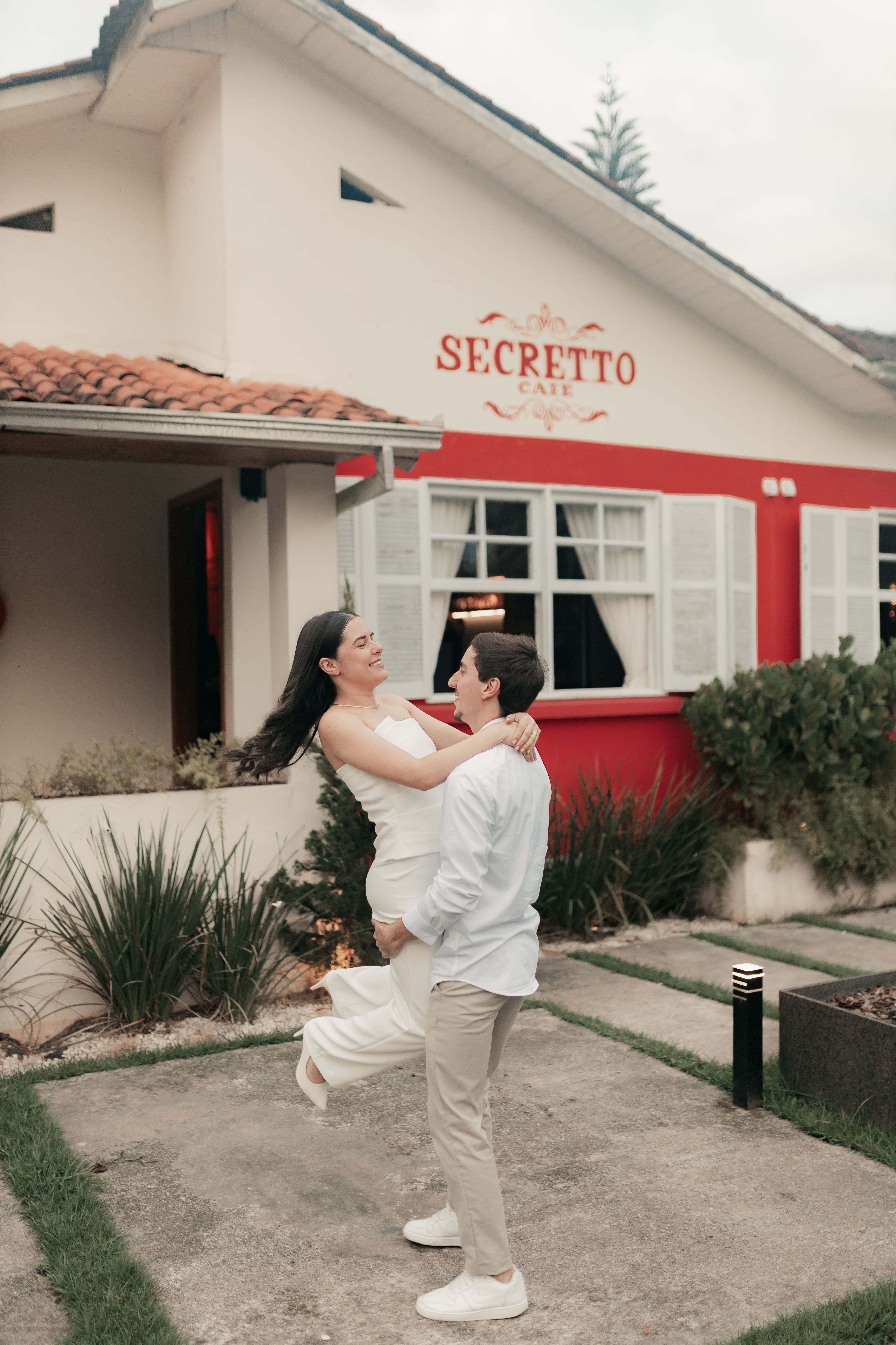 A happy couple enjoying a romantic moment outside Secreto Cafe.