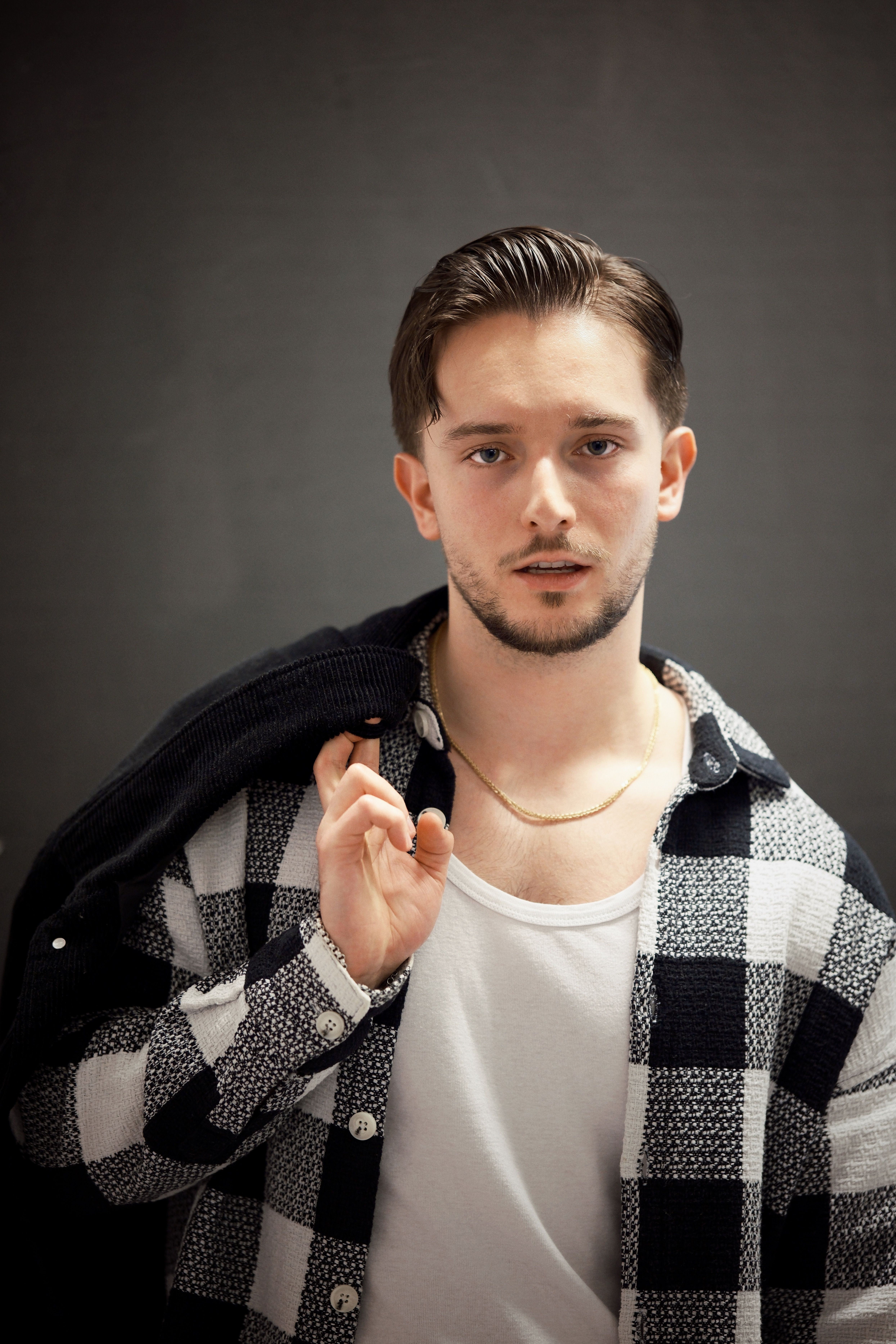 Stylish Young Man in Checkered Shirt Portrait · Free Stock Photo — free download