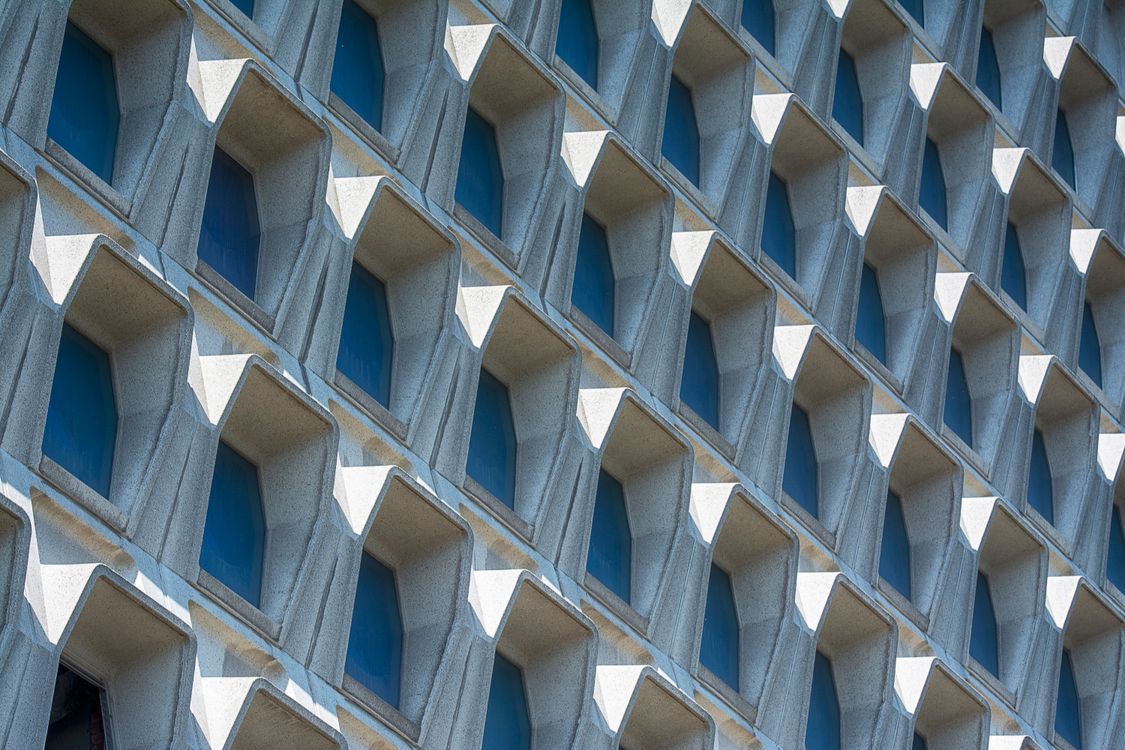 Geometric Architectural Facade with Repetitive Patterns · Free Stock Photo