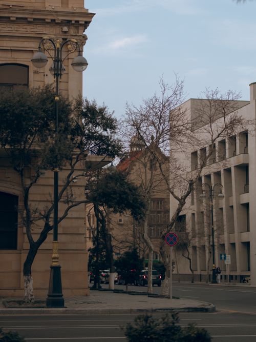 Free Charming city street with classic architecture and vintage street lamps. Stock Photo