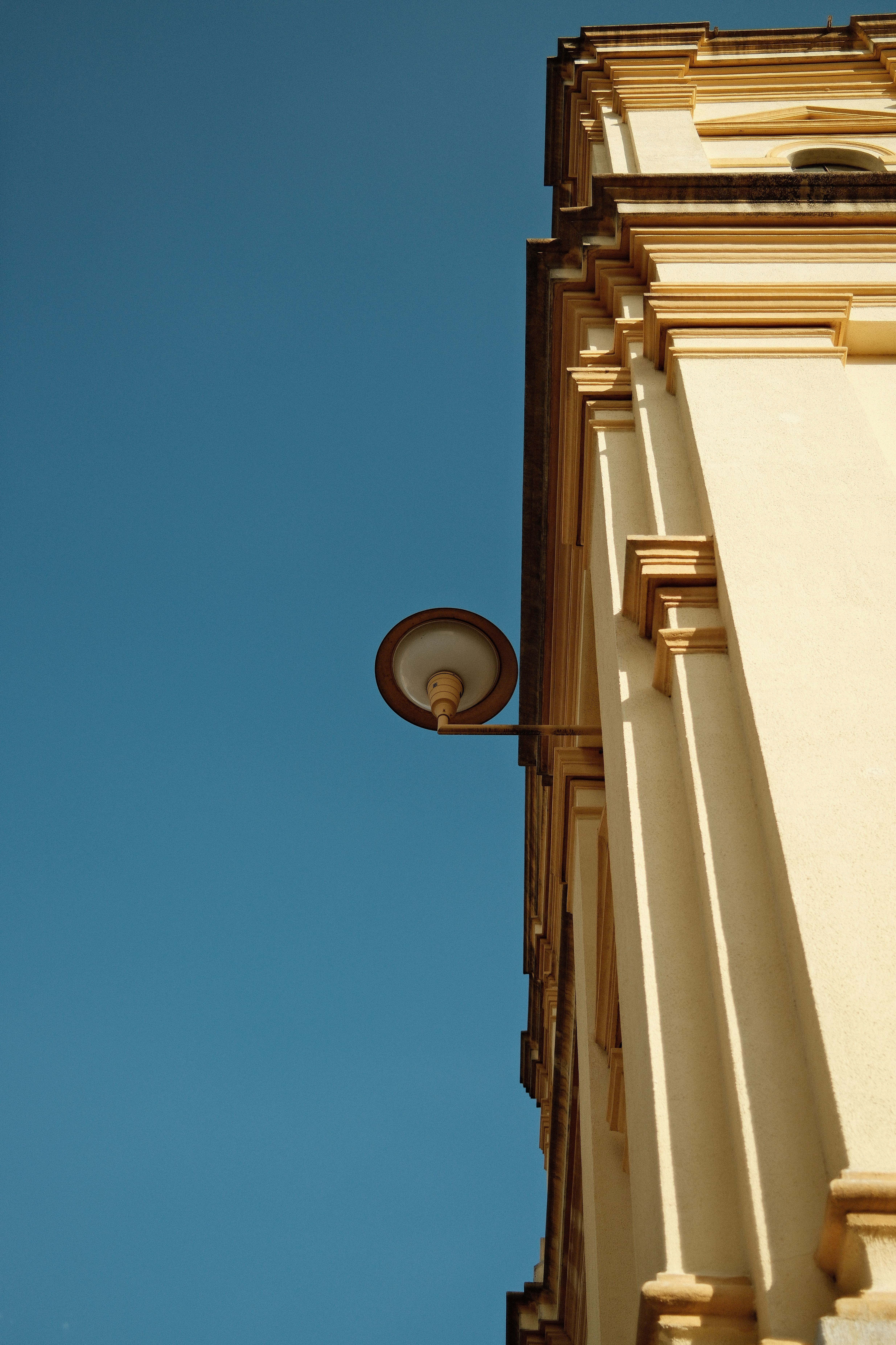 Classic Building Facade Against Blue Sky · Free Stock Photo