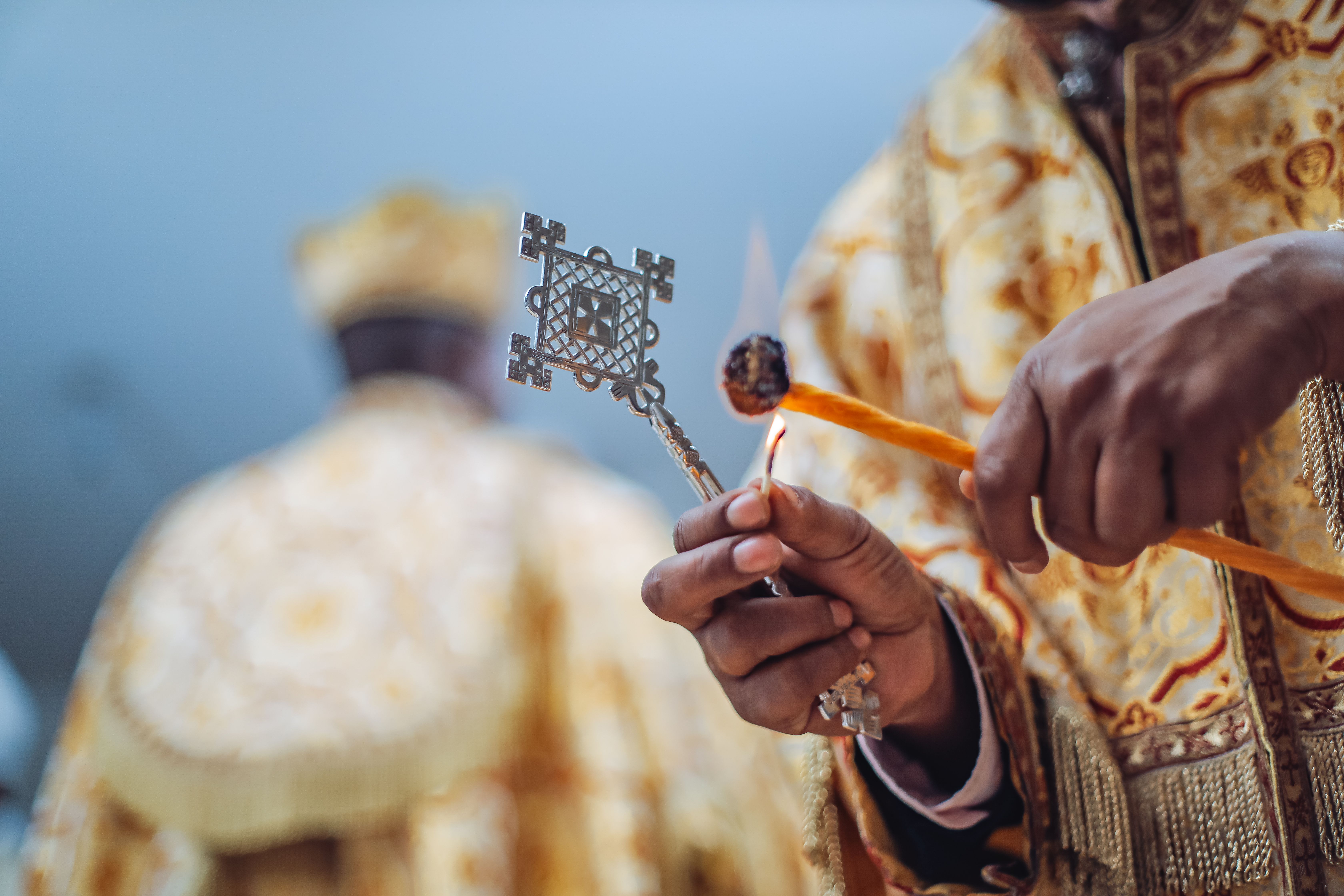 Ethiopian Orthodox Clergy with Ceremonial Cross · Free Stock Photo