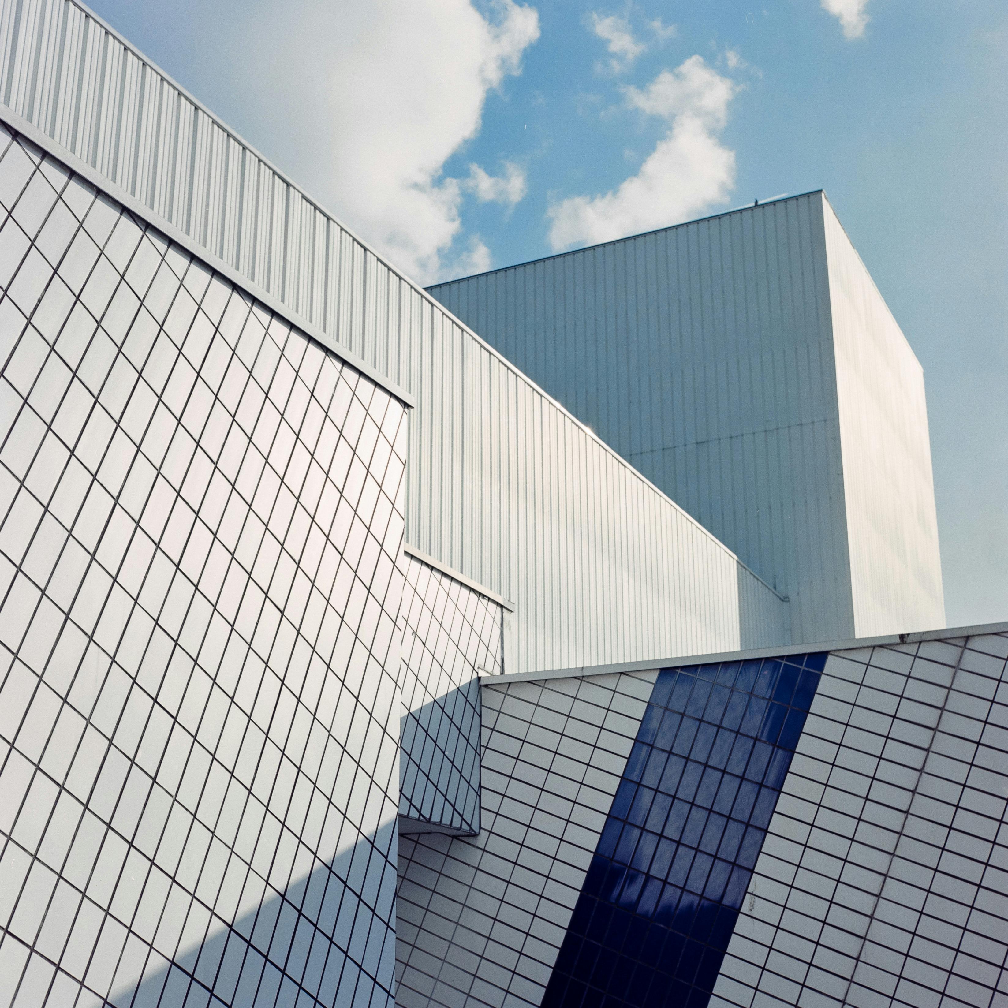 Contemporary architecture with sleek lines and a vibrant blue sky background.