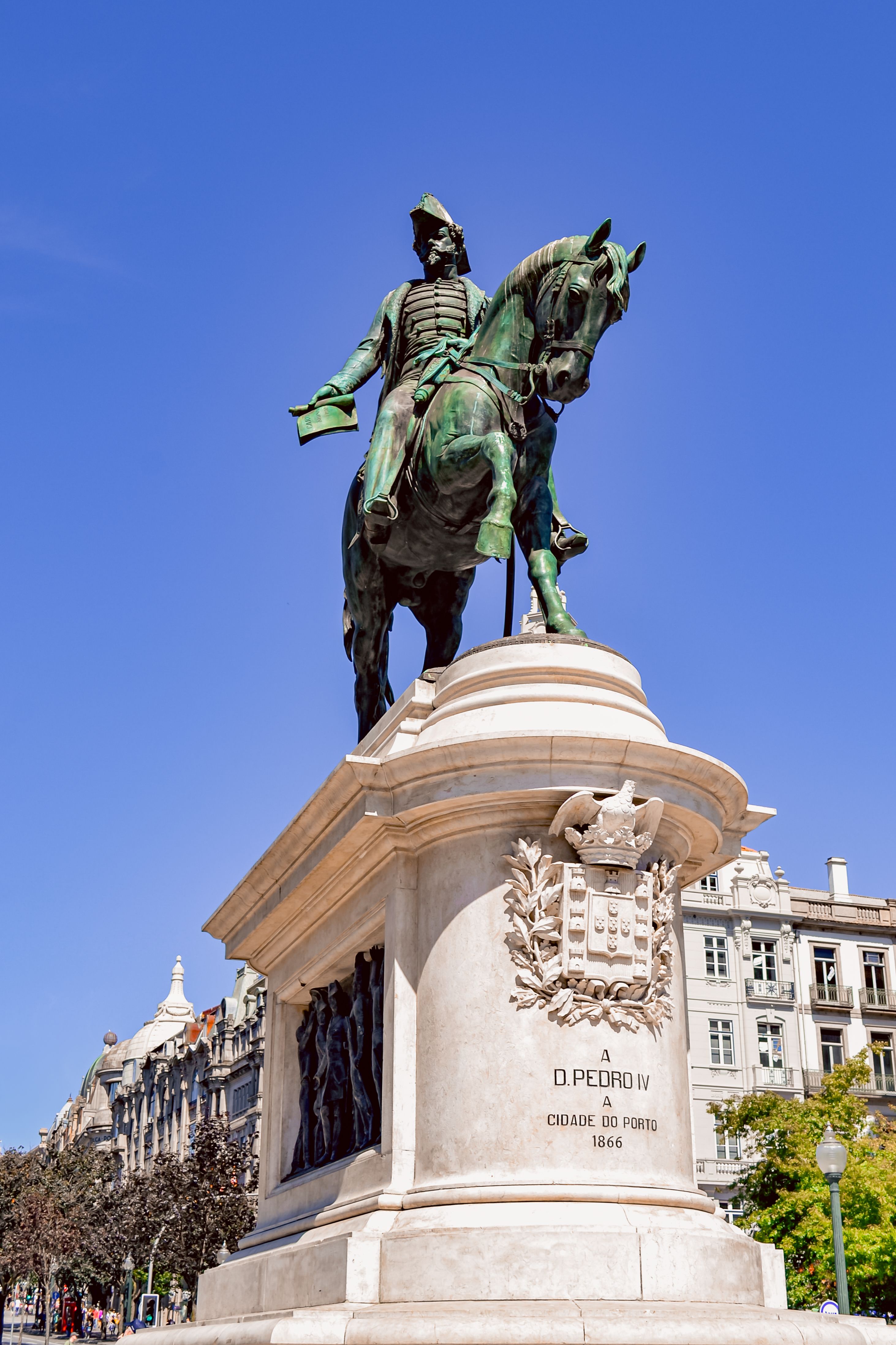 The famous equestrian statue of King Dom Pedro IV in Porto's central square, a notable tourist attraction in Portugal.