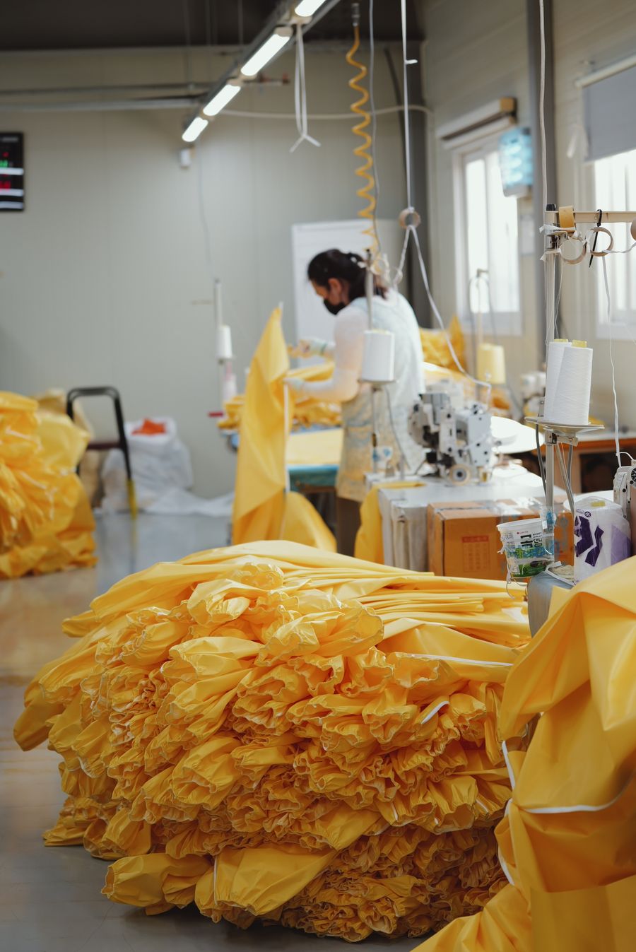Sewing station with yellow fabric