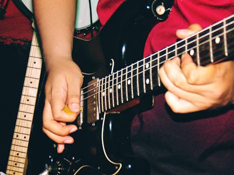 Dynamic close-up of hands playing an electric guitar with a distinct rock vibe.