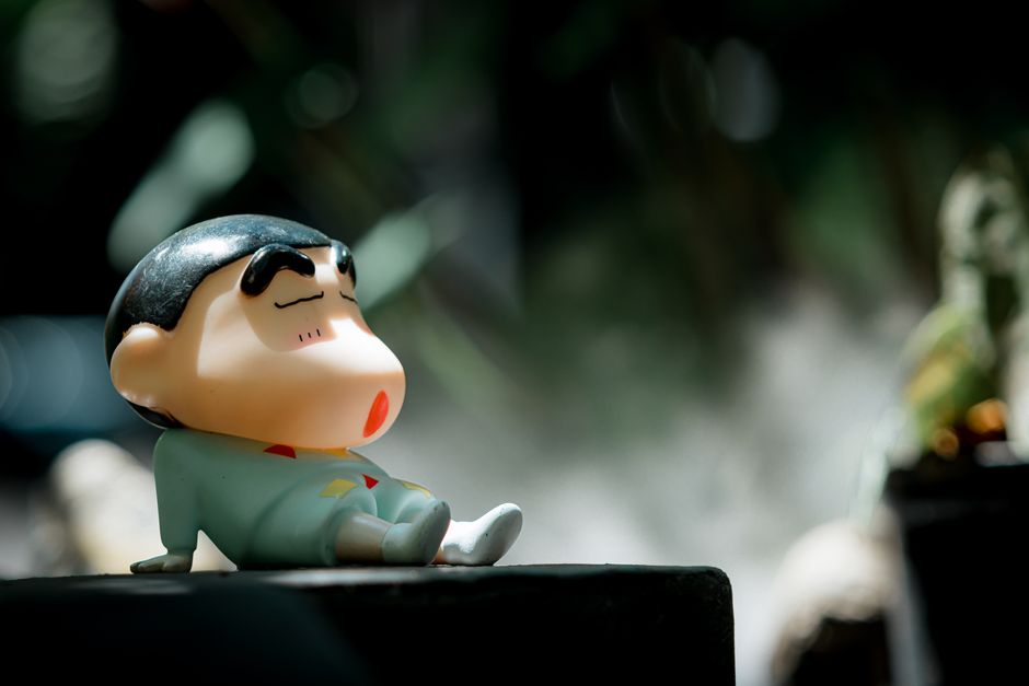 Cute cartoon character relaxing on a sunny day outdoors.