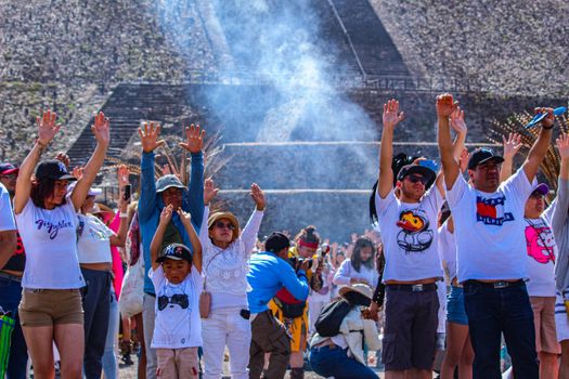 Tourists enjoy a lively gathering at the famous Teotihuacan pyramids, embracing the spring season.