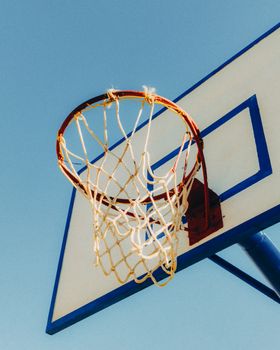 Minimalist shot of a basketball hoop under a clear sky in Kenitra, Morocco.