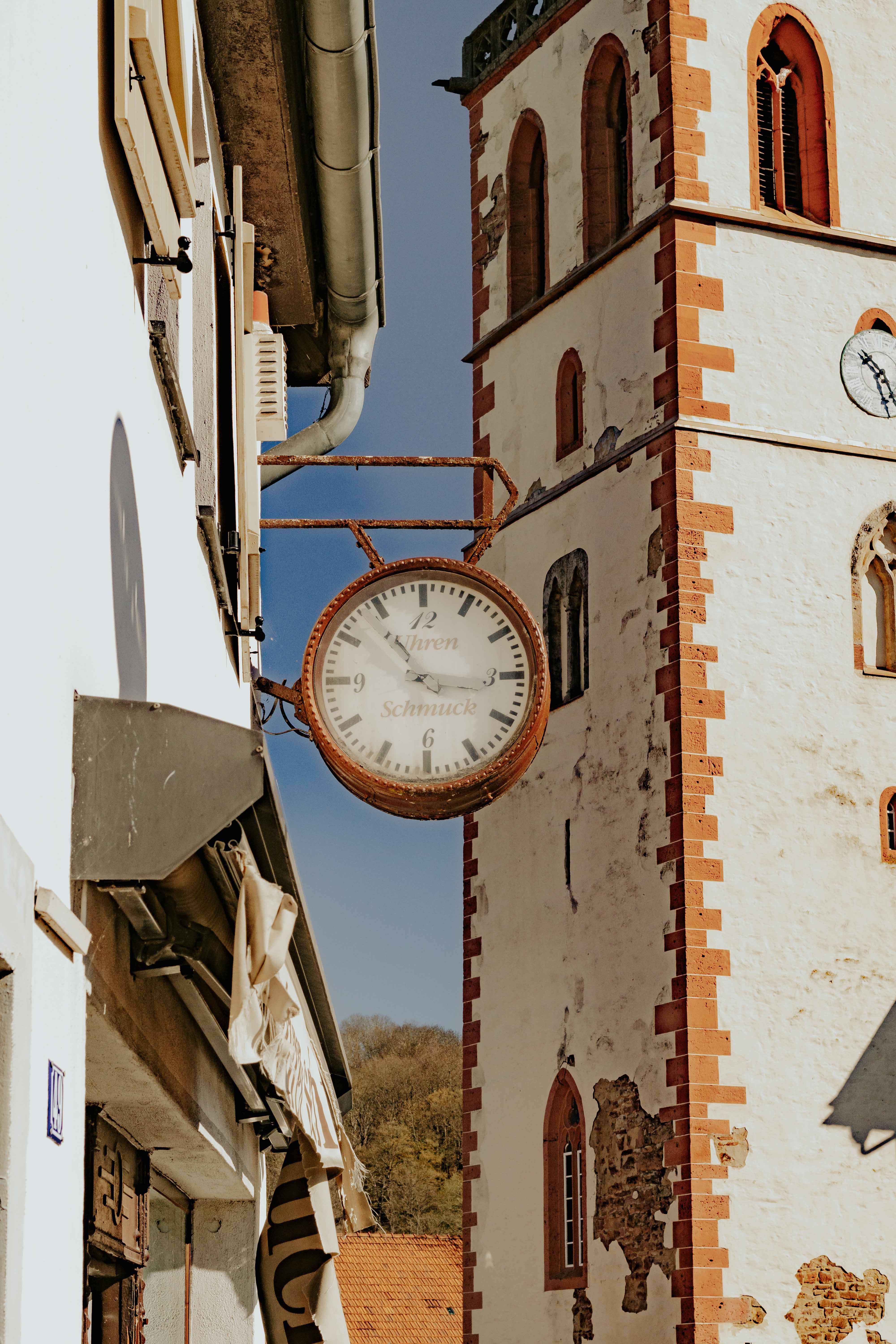 Charming Clock with Historical Tower in Small Town · Free Stock Photo