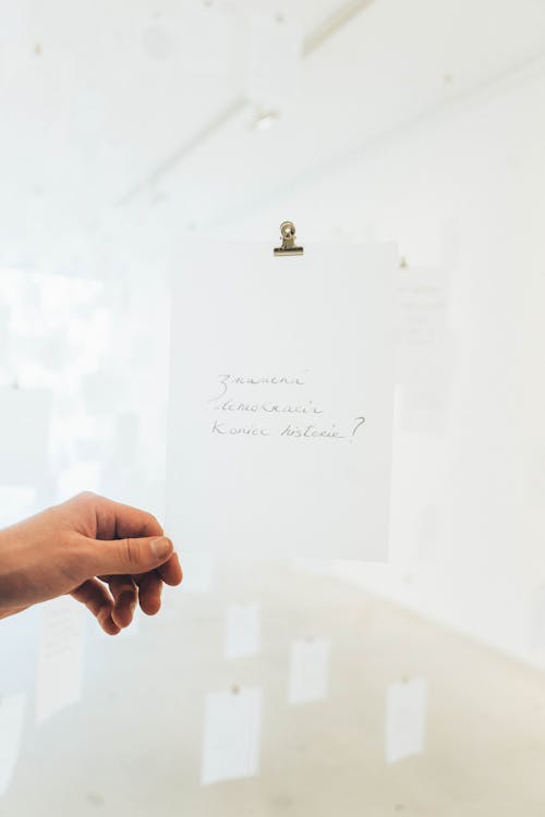 Photo Of Person Holding Paper