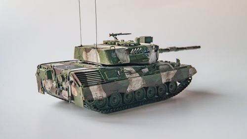 Free Detailed model of a Leopard 2 tank with camouflage and military insignia. Stock Photo