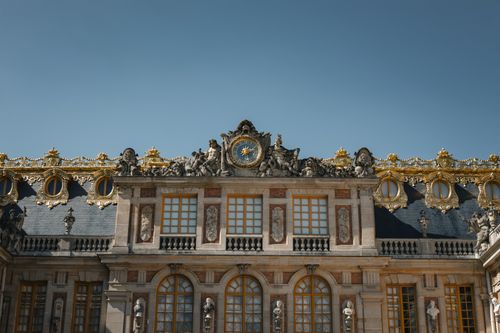 Free Stunning view of Versailles Palace facade in France with intricate architecture under clear blue skies. Stock Photo