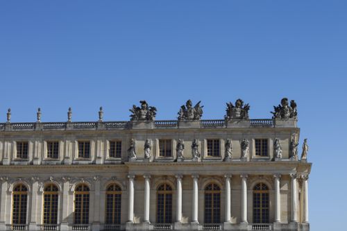 Free Elegant architecture of Versailles Palace under a clear blue sky in France. Stock Photo