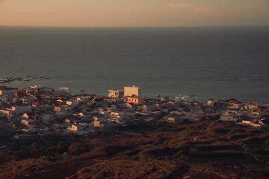 Serene sunset over a coastal village in Bình Thuận, Vietnam, captured from above.