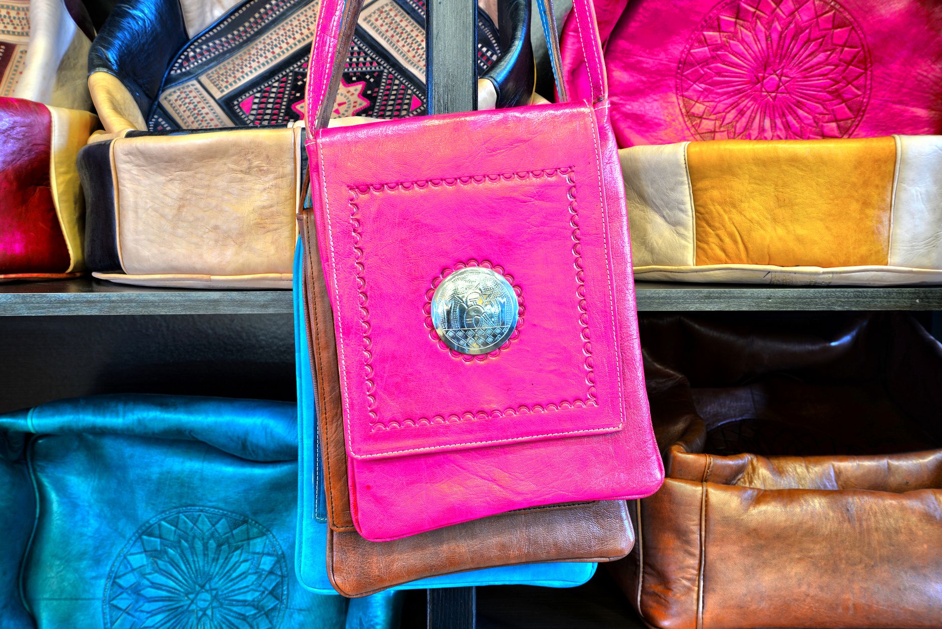 Leather goods on display in a Moroccan market
