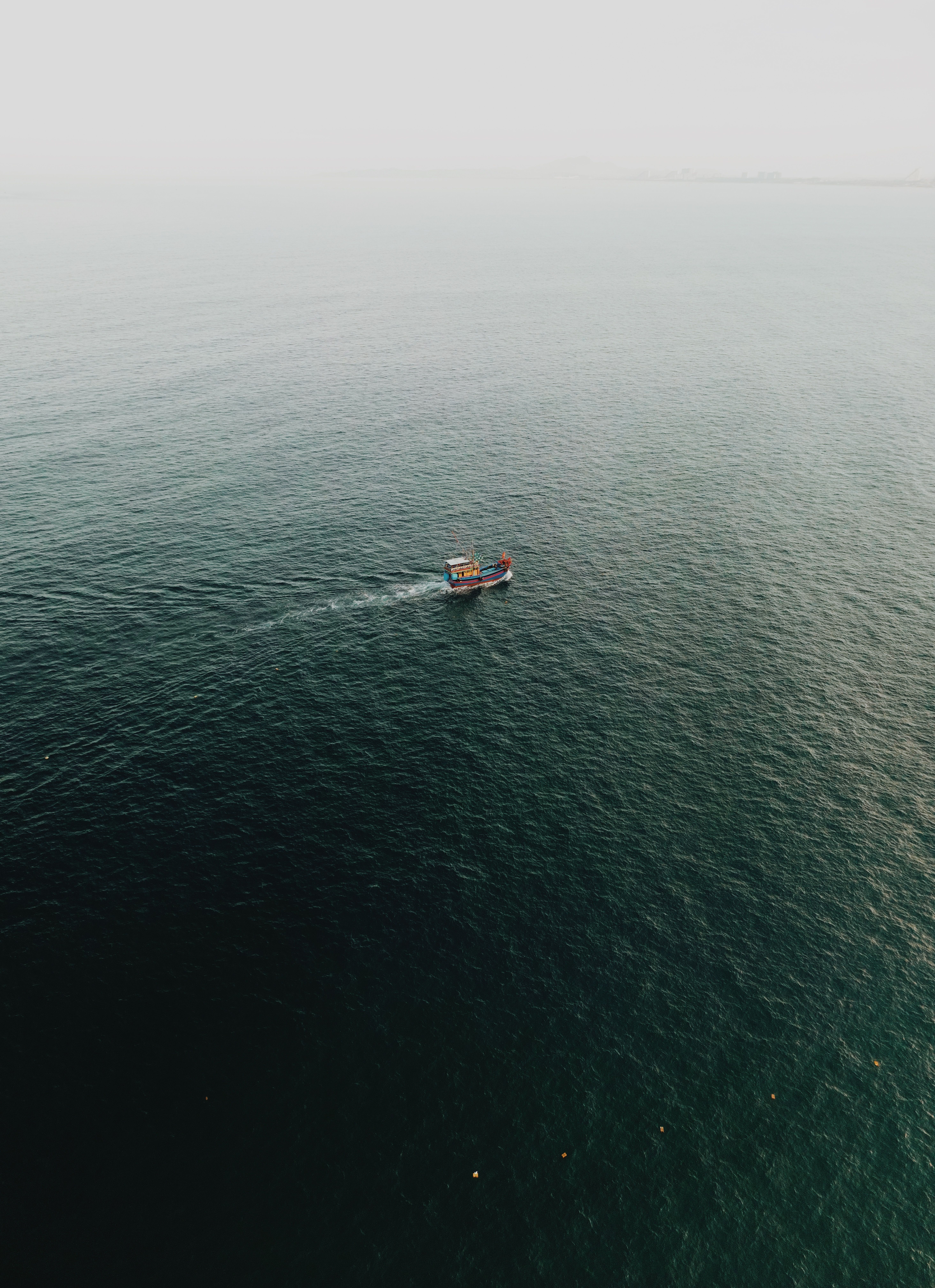 Solitary Boat across the Vast Ocean