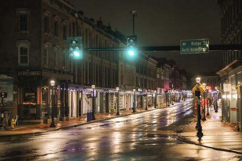 Free A quiet, illuminated street scene in downtown Norwalk after rain. Stock Photo