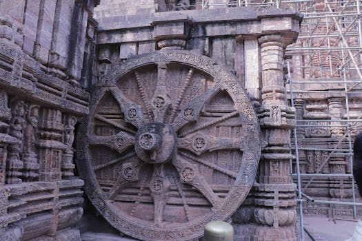 Ancient stone carved wheel at Konark Sun Temple in Odisha, India.