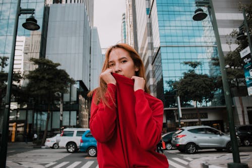 Photo Of Woman Standing Near Post