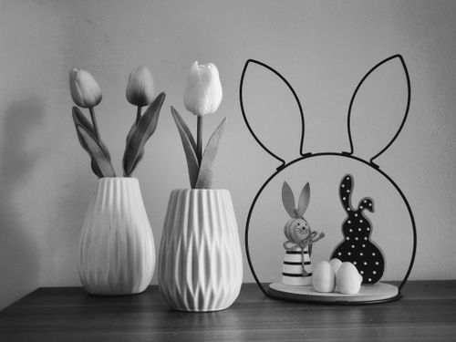 Free Elegant black and white Easter decoration with tulips and bunny figures. Stock Photo