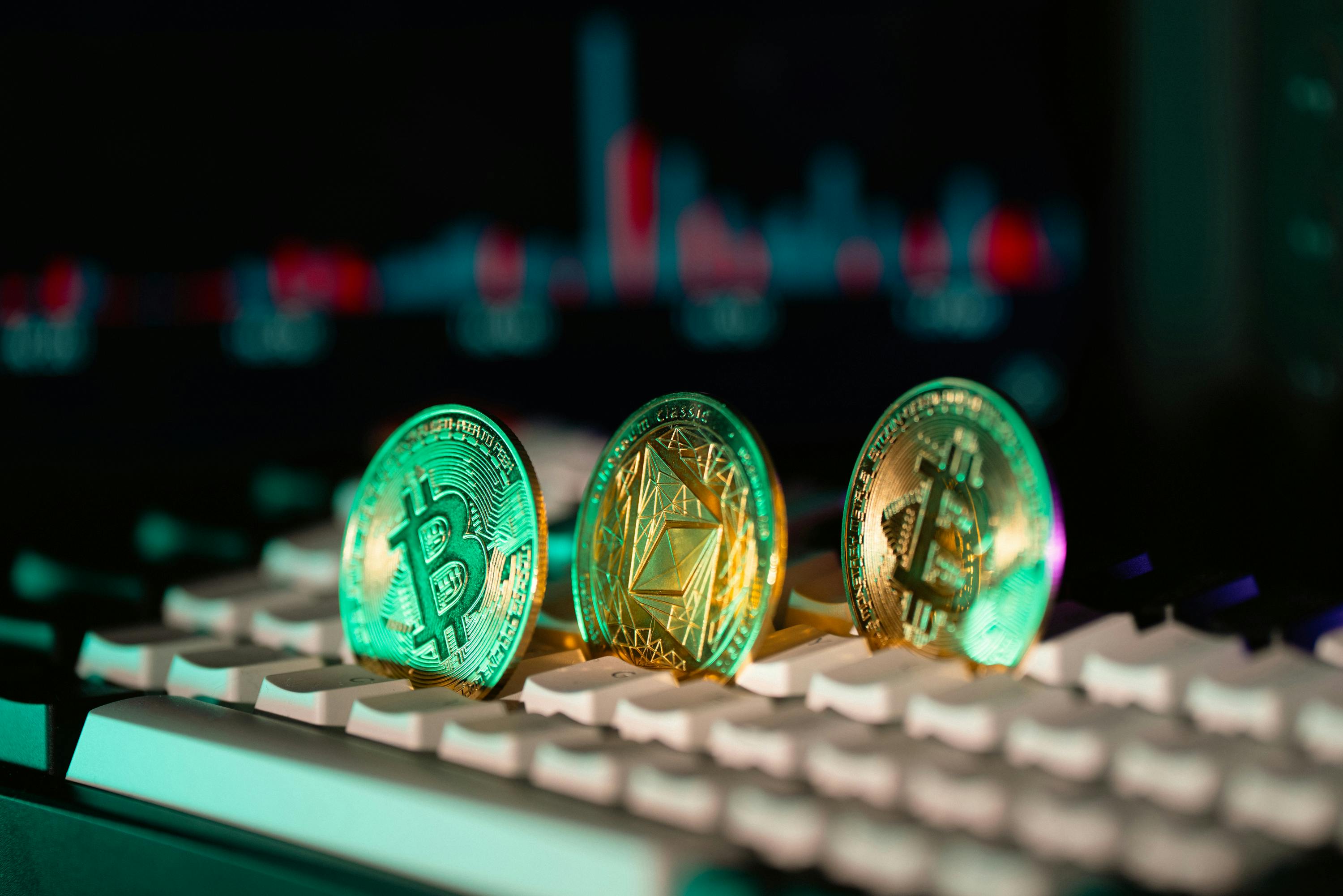 Cryptocurrency Coins on Keyboard with Candlestick Chart · Free Stock Photo