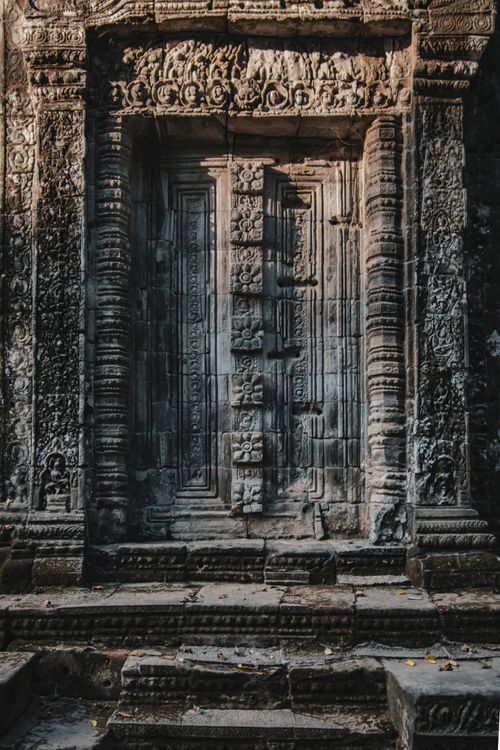 Free Intricate stone doorway of an ancient temple in Angkor Wat, Cambodia, showcasing Khmer architecture. Stock Photo