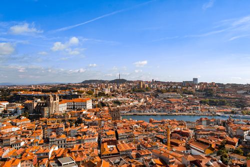 Free Scenic panorama of Porto, Portugal, showcasing historic architecture and the Douro River. Stock Photo