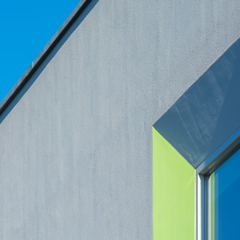 Exterior Painting in Finsbury — a decorator at work mid-project