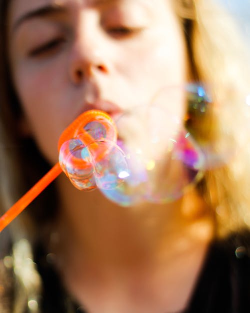 Woman Playing With Bubbles