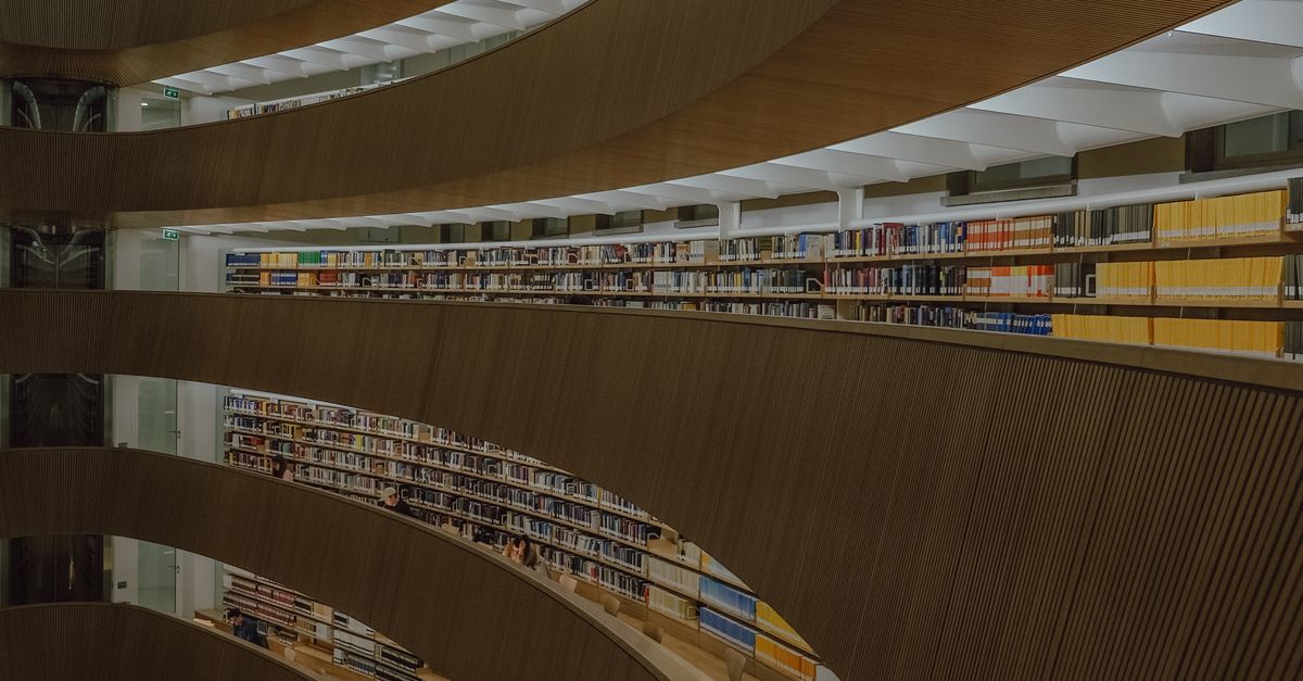 Library. Design Curved Rows Modern Architectural Library with Curved Shelves · Free Stock Photo