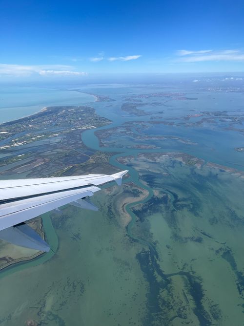 Free Stunning aerial view of Venetian Lagoon showcasing beautiful water textures and Italian coastline. Stock Photo