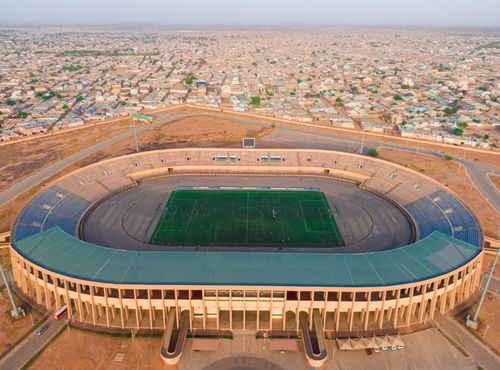 Free A stunning aerial view of a football stadium located in Nigeria surrounded by a sprawling urban area. Stock Photo